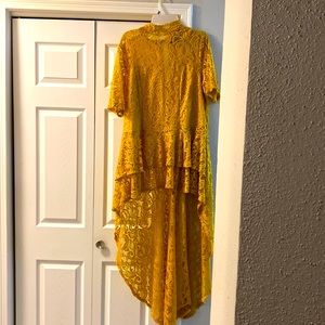 Mustard color yellow short front long back to the floor .
